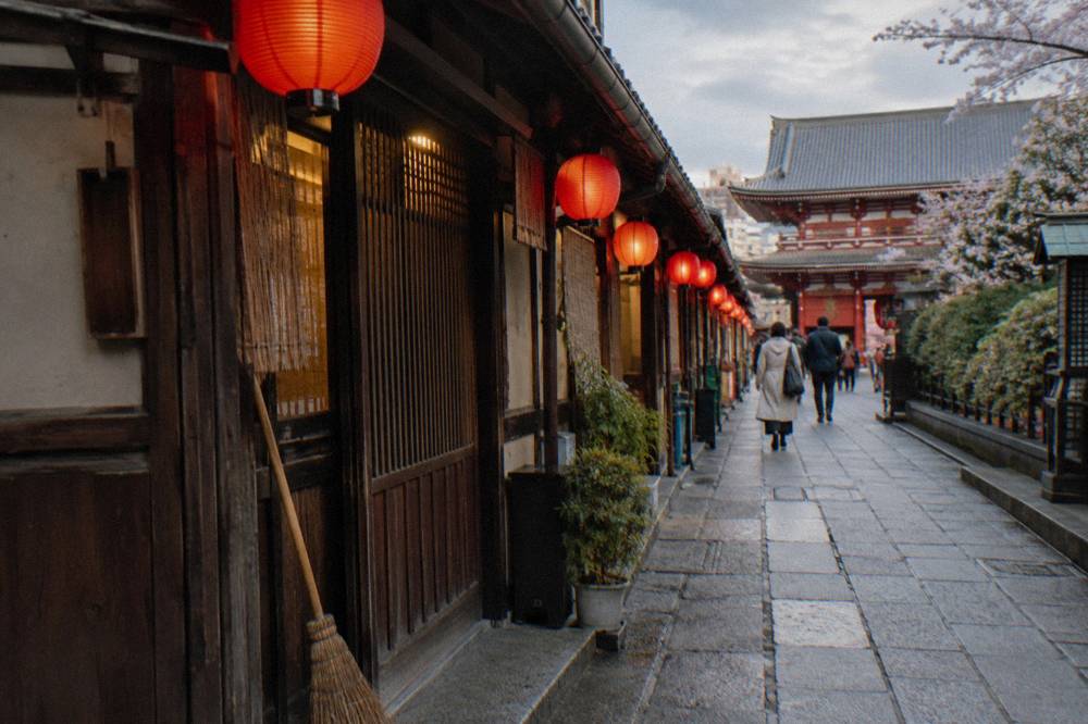 Lantern-lit shopping street in an old Tokyo neighbourhood in the early evening